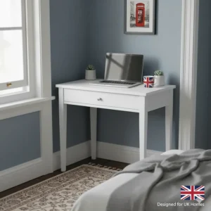 A small white corner desk tucked into a typical British bedroom alcove to maximise limited floor space.
