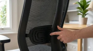 Close-up illustration of a swivel chair's adjustable lumbar support to prevent back pain during long working hours.