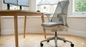 Alt text for image 9: A photorealistic illustration of the sophisticated ergonomic task chair from image_6.png, now vacant and positioned at a light oak desk near a window. The focus is exclusively on the pristine chair, highlighting the short-cylinder gas lift design and intricate mechanical controls for multi-function adjustment.