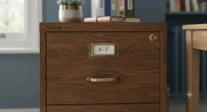 Close-up view of a secure locking mechanism on a white 2-drawer filing cabinet for data protection.