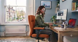 An orange office chair creating a warm, collaborative atmosphere for better team productivity.