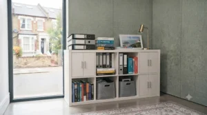 Sturdy cube storage unit for an office packed with heavy ring binders, ledgers, and reference books.