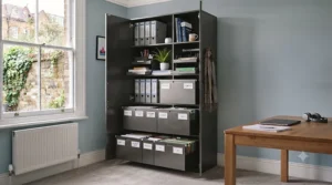 Open view of a tall storage cabinet for an office, showing adjustable shelves organised with lever-arch files and folders.