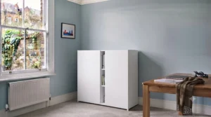 Versatile tall storage cabinet for an office used in a multi-functional hybrid workspace to keep paperwork tidy.