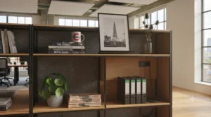 A double-sided modular shelving system acting as a collaborative space divider in a design agency.